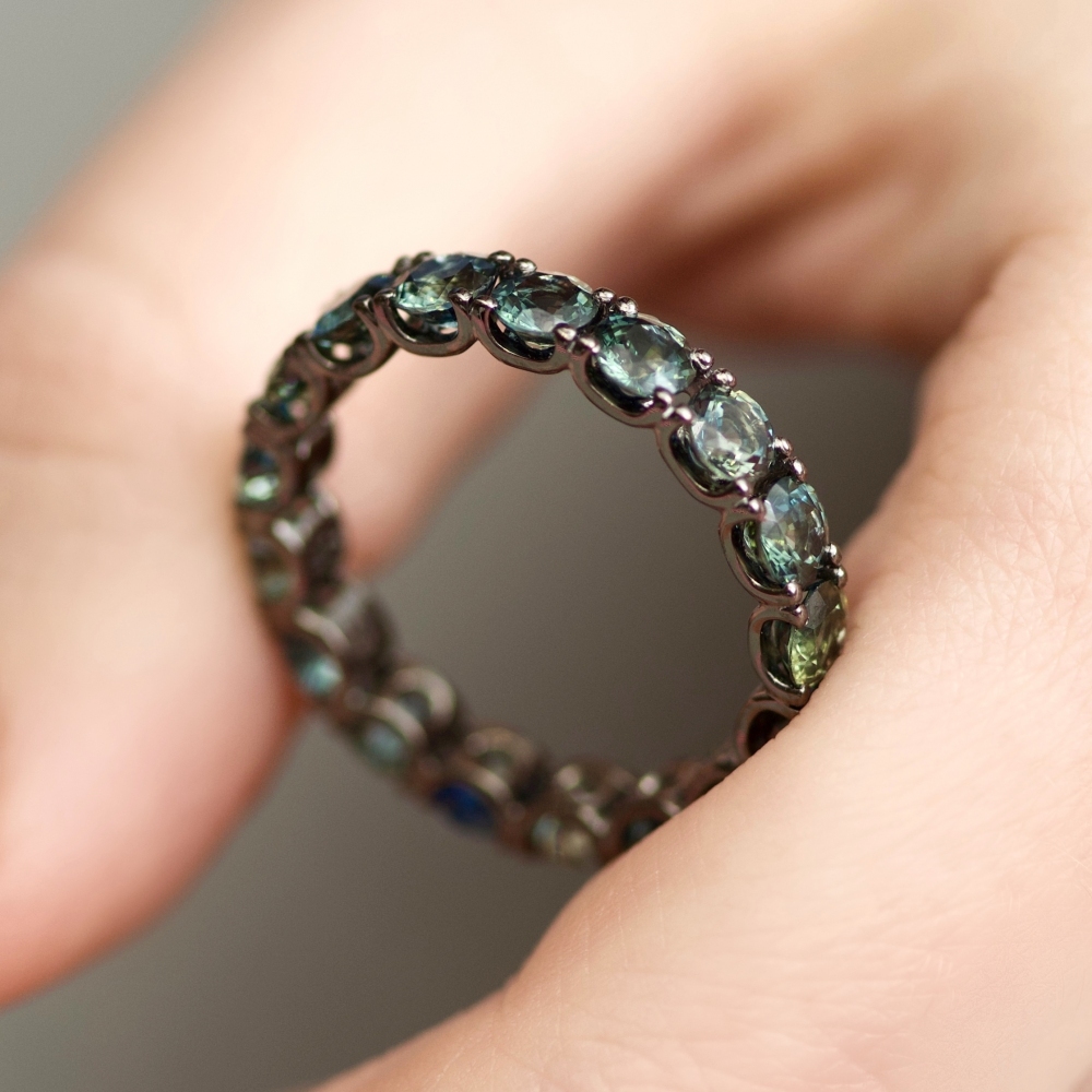 Infinity ring with marriage sapphires in black gold